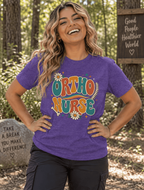 Retro Ortho Nurse Shirt with 1970s lettering, daisies, bone and spine graphic, front view