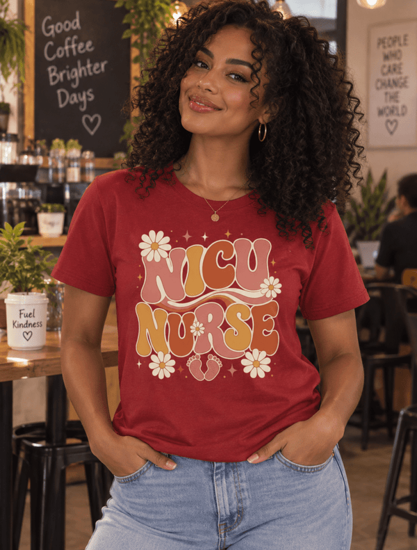 Retro NICU Nurse Shirt with 1970s lettering, daisies and baby footprints, front view